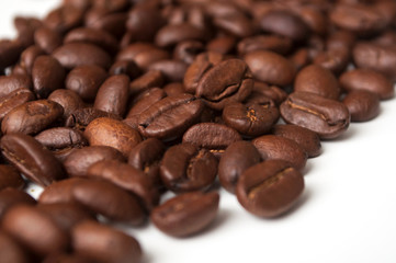 closeup of coffee beans on white background