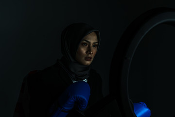 Muslimah fighter with low light view.