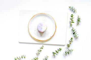 woman table with notebook, macaroons and eucalyptus top view mock-up
