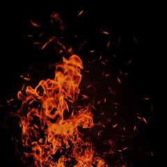 Vintage abstract flames with fire particles embers on isolated background.