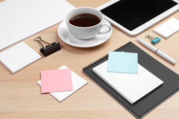 Corporate identity design template on wooden desk close up