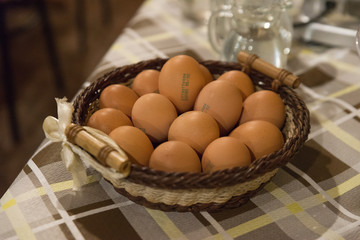 Basket full of fresh biological eggs just collected