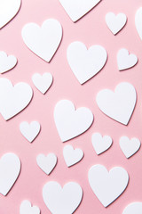 White hearts on a pastel pink background. Valentine's day, Mother's day background