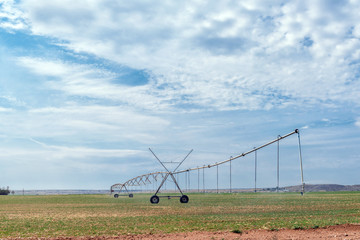 Fototapeta na wymiar Center pivot irrigation system in operation near Orania