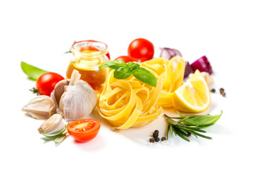 Italian cuisine concept - raw pasta and ingredients. Healthy vegetarian diet, isolated on white