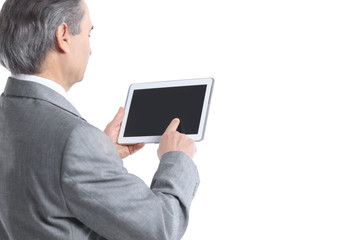 close up.the businessman points to the tablet screen.rear view.isolated on white background