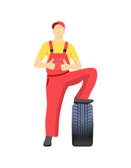 Mechanic Standing on Tire and Shows Approval Sign