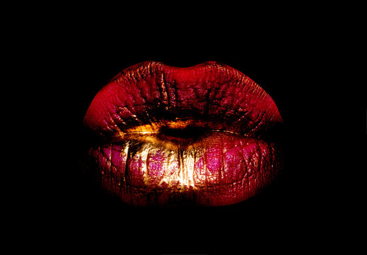 Golden red lips. Woman mouth icon. Lips isolated on black background. Luxury cosmetics concept. Smile or kiss.