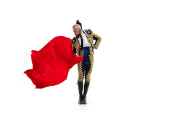 Torero in blue and gold suit or typical spanish bullfighter isolated over white studio background....