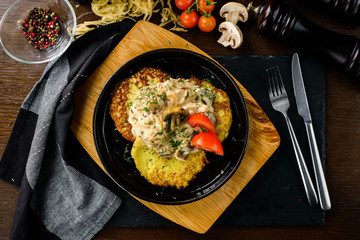 homemade potato pancakes, Vegetable fritters. Latkes in frying pan