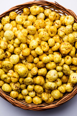 Roasted Phool Makhana or Crispy Lotus pops Seed served in a bowl, selective focus