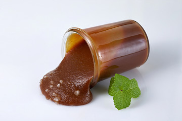 jar of salted caramel  on white background