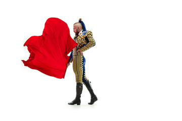 Torero in blue and gold suit or typical spanish bullfighter isolated over white studio background....