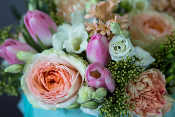 roses, tulips and mimosa gathered in a beautiful bouquet