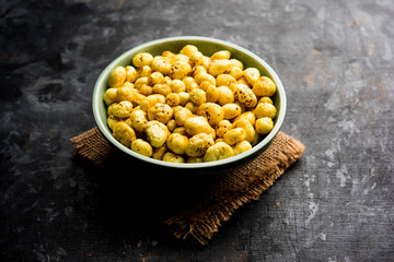 Roasted Phool Makhana or Crispy Lotus pops Seed served in a bowl, selective focus