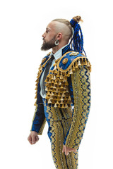 Torero in blue and gold suit or typical spanish bullfighter isolated over white studio background. The taming, achieving the goal, mortification, conquest, boss, leadership, battle, win, winner