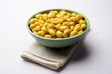 Roasted Phool Makhana or Crispy Lotus pops Seed served in a bowl, selective focus