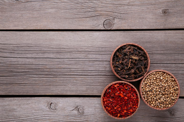 Spices mix on a grey wooden background. Top view