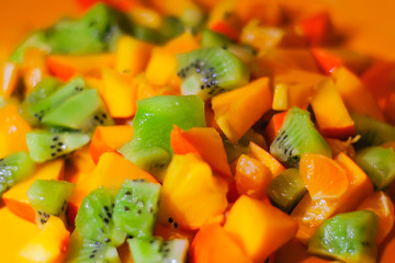 sliced citrus. orange, mandarin, kiwi, persimmon. fruit vitamin salad.