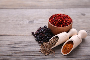 Spices mix on a grey wooden background. Top view