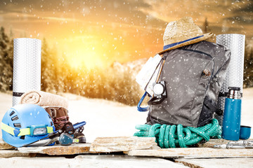 Winter time and backpack on stone. Free space for your decoration. 