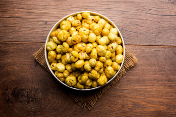 Roasted Phool Makhana or Crispy Lotus pops Seed served in a bowl, selective focus