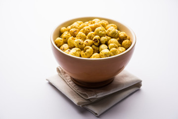 Roasted Phool Makhana or Crispy Lotus pops Seed served in a bowl, selective focus