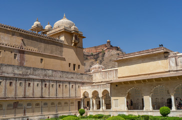 Fototapeta premium Beautiful view of Amber Sheesh Mahal Garden in Amber Fort, Constructed of red sandstone and marble. Located in Amer town in Jaipur, Rajasthan, India