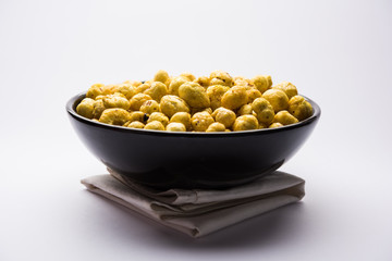Roasted Phool Makhana or Crispy Lotus pops Seed served in a bowl, selective focus