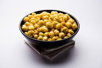 Roasted Phool Makhana or Crispy Lotus pops Seed served in a bowl, selective focus