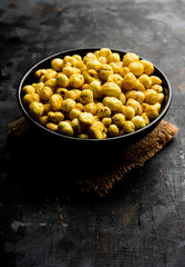 Roasted Phool Makhana or Crispy Lotus pops Seed served in a bowl, selective focus