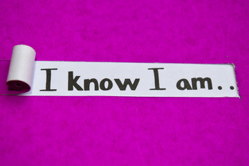 I know I am text, Inspiration, Motivation and business concept on purple torn paper