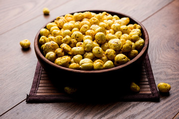 Roasted Phool Makhana or Crispy Lotus pops Seed served in a bowl, selective focus