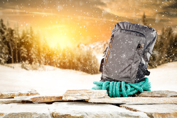 Winter composition of backpack and mountains landscape 