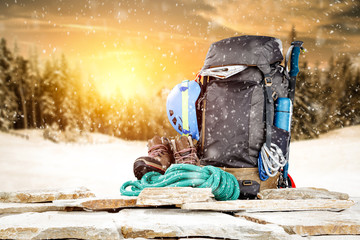 Winter composition of backpack and mountains landscape 