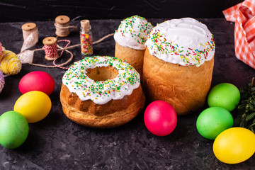 Easter, cake, eggs, holiday. Easter cake and colorful eggs on a dark background. It can be used as a background