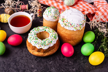 Easter, cake, eggs, holiday. Easter cake and colorful eggs on a dark background. It can be used as a background