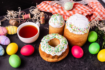 Easter, cake, eggs, holiday. Easter cake and colorful eggs on a dark background. It can be used as a background