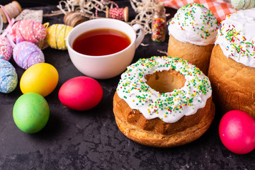 Easter, cake, eggs, holiday. Easter cake and colorful eggs on a dark background. It can be used as a background
