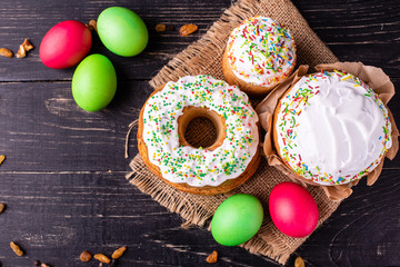 Easter, cake, eggs, holiday. Easter cake and colorful eggs on a dark background. It can be used as a background