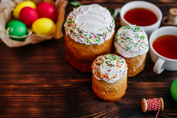 Easter, cake, eggs, holiday. Easter cake and colorful eggs on a dark background. It can be used as a background