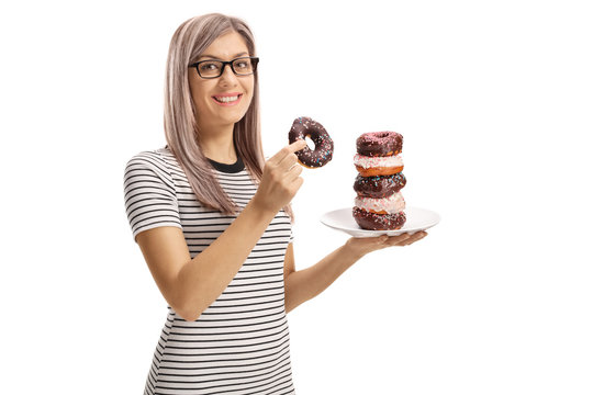 Young woman holding a chocolate donut