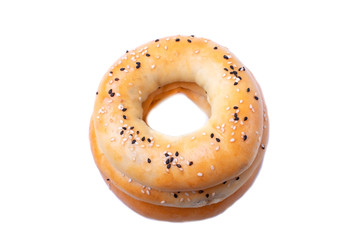 Three bagels sprinkled with sesame seeds. Isolated object
