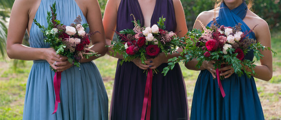 bridesmaids holding flowers in their hands