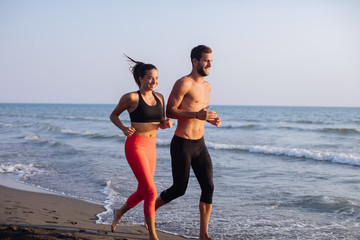 Fototapeta na wymiar Couple Jogging by the Sea