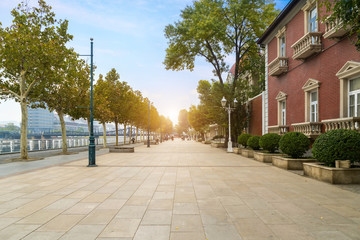 empty tiled floor and urban skyline,tianjin china