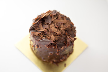 chocolate birthday cake with candle on white background