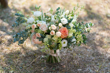 rustic wedding bouquet stands on the lawn