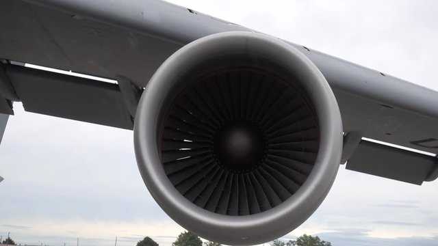 Close Up Of Jet Engine Turbine With Trees And Sky In Background