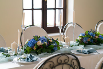 decorated table in the restaurant for a wedding dinner